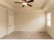 Spacious main bedroom featuring neutral walls, carpet, a ceiling fan, and natural light at 142 Susie Creek Ln, Villa Rica, GA 30180