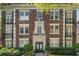 Classic brick apartment building with charming balconies and well-maintained landscaping at 20 Collier Nw Rd # 11, Atlanta, GA 30309