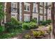 Beautifully landscaped front yard with lush greenery and colorful flower beds at 20 Collier Nw Rd # 11, Atlanta, GA 30309