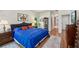Comfortable bedroom with wood floors, stylish rugs, and sophisticated decor at 2095 Southers Cir, Suwanee, GA 30024