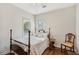 Bedroom featuring hardwood floors, natural light, and neutral décor for a restful ambiance at 2095 Southers Cir, Suwanee, GA 30024