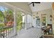 Inviting covered patio with comfortable seating and beautiful views of the surrounding nature at 2095 Southers Cir, Suwanee, GA 30024