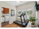 Multi-purpose exercise room featuring laundry facilities and a treadmill at 2095 Southers Cir, Suwanee, GA 30024