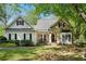 Charming single-Gathering home with stone accents, a well-manicured lawn, and a welcoming entrance at 2095 Southers Cir, Suwanee, GA 30024