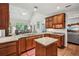 Open kitchen with granite countertops, stainless steel appliances, and a breakfast nook at 2095 Southers Cir, Suwanee, GA 30024
