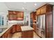 Bright kitchen with stainless steel appliances, granite countertops, and custom wood cabinetry at 2095 Southers Cir, Suwanee, GA 30024