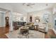 Open-concept living room with hardwood floors, neutral paint, and a cozy seating area at 2095 Southers Cir, Suwanee, GA 30024