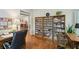 Bright office space features custom built-ins, hardwood flooring, and lots of natural light at 2095 Southers Cir, Suwanee, GA 30024