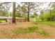 Expansive backyard, partially cleared, with a view of neighboring properties and mature trees at 5032 Central Church Rd, Douglasville, GA 30135