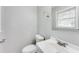This bathroom offers a modern sink and fixtures as well as a window at 5032 Central Church Rd, Douglasville, GA 30135