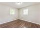 Bedroom featuring neutral paint, wood-look floors and natural light at 5032 Central Church Rd, Douglasville, GA 30135