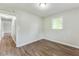 Bedroom featuring wood-look floors, natural light and neutral walls at 5032 Central Church Rd, Douglasville, GA 30135