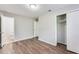 This bedroom offers hardwood-style floors and an ensuite bathroom; a closet provides ample storage at 5032 Central Church Rd, Douglasville, GA 30135
