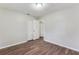 Bedroom featuring a closet, wood-look floors and neutral paint at 5032 Central Church Rd, Douglasville, GA 30135