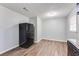 Eat-in kitchen with wood-look flooring, stainless steel appliances and neutral gray walls at 5032 Central Church Rd, Douglasville, GA 30135