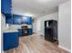 Well-lit kitchen showcasing wood floors, updated appliances, and ample counter space, perfect for cooking at 5032 Central Church Rd, Douglasville, GA 30135