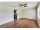 Inviting living room featuring new flooring, a ceiling fan, neutral walls, and natural light at 5032 Central Church Rd, Douglasville, GA 30135