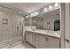 Bathroom featuring double vanity, marble counters, and glass shower at 1372 Doublegate Dr, Atlanta, GA 30319