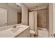 Neutral bathroom featuring a shower-tub combination and a white vanity with ample counter space at 1372 Doublegate Dr, Atlanta, GA 30319