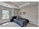 Bedroom featuring neutral walls, carpet, and tray ceiling at 1372 Doublegate Dr, Atlanta, GA 30319