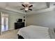 Bedroom features neutral walls, carpet, ceiling fan, and adjoining room at 1372 Doublegate Dr, Atlanta, GA 30319