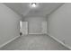Spacious bonus room featuring neutral carpeting and paint, ready for customization and flexible use at 1372 Doublegate Dr, Atlanta, GA 30319