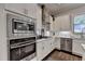 Well-equipped kitchen featuring stainless steel appliances, white cabinetry, and ample countertop space at 1372 Doublegate Dr, Atlanta, GA 30319