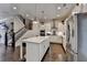 Modern kitchen with a center island, stainless steel appliances, and elegant white cabinetry at 1372 Doublegate Dr, Atlanta, GA 30319