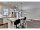 Bright kitchen featuring a center island, stainless steel appliances, and modern white cabinetry at 1372 Doublegate Dr, Atlanta, GA 30319
