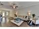 Open-concept living room with hardwood floors, modern furniture, and ample natural light at 1372 Doublegate Dr, Atlanta, GA 30319