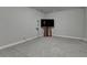 Carpeted Living Room featuring a TV set against a wall, offering a cozy and modern entertainment space at 1372 Doublegate Dr, Atlanta, GA 30319