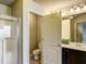 Bathroom featuring a walk-in closet, shower, toilet and vanity at 2722 Sardis Chase Ct, Buford, GA 30519