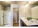Bathroom featuring a double sink vanity and stand-up shower at 2722 Sardis Chase Ct, Buford, GA 30519