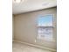 Bright bedroom featuring a window with view and neutral color scheme at 2722 Sardis Chase Ct, Buford, GA 30519