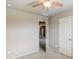 Neutral bedroom features plush carpet, ceiling fan, and white door at 2722 Sardis Chase Ct, Buford, GA 30519