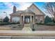 Clubhouse entry featuring a stone facade, double doors, and well-maintained landscaping at 2722 Sardis Chase Ct, Buford, GA 30519