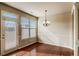 Bright dining area with hardwood floors, elegant chandelier, and a door to the patio at 2722 Sardis Chase Ct, Buford, GA 30519