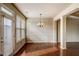 Bright dining area with large windows, hardwood floors, and an elegant chandelier at 2722 Sardis Chase Ct, Buford, GA 30519