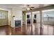 Bright and airy living room boasts hardwood floors, a fireplace, and elegant architectural columns at 2722 Sardis Chase Ct, Buford, GA 30519