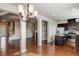 Spacious living area showcasing hardwood floors, a modern chandelier, and an open floor plan at 2722 Sardis Chase Ct, Buford, GA 30519