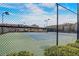 Community tennis courts viewed through a chain link fence with landscaping at 2722 Sardis Chase Ct, Buford, GA 30519