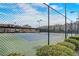 A full tennis court is fenced with green shrubbery at 2722 Sardis Chase Ct, Buford, GA 30519