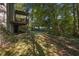 Spacious backyard with lush trees and open deck, ideal for outdoor entertaining at 415 Westlake Nw Ct, Marietta, GA 30064