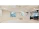 Basement rec room features wainscoting, carpet and windows to the backyard at 415 Westlake Nw Ct, Marietta, GA 30064