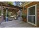 Relaxing covered deck with outdoor seating and charming string lights, perfect for gatherings at 415 Westlake Nw Ct, Marietta, GA 30064