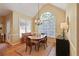 Bright dining room with a chandelier, large arched window, and hardwood floors at 415 Westlake Nw Ct, Marietta, GA 30064