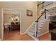 Inviting foyer showcasing hardwood floors, a staircase, and elegant decor leading into the dining room at 415 Westlake Nw Ct, Marietta, GA 30064