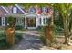 Charming walkway leads to a classic front door framed by lush greenery and brick columns at 415 Westlake Nw Ct, Marietta, GA 30064