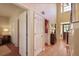 Bright hallway with hardwood floors, multiple doorways, and a view of the staircase at 415 Westlake Nw Ct, Marietta, GA 30064