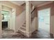 Hallway with wainscoting features staircase and doorway views to bathroom and living room at 415 Westlake Nw Ct, Marietta, GA 30064